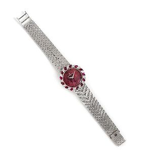 An 18 Karat White Gold, Ruby and Diamond Wristwatch, Universal Geneve,