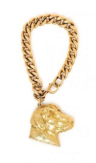 * A Yellow Gold Curb Link Bracelet with Attached 14 Karat Yellow Gold Labrador Show Dog Locket Charm, Circa 1950's, 56.00 dwts.