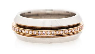 An 18 Karat White Gold, Rose Gold and Diamond Spinning Ring, Alan Friedman, 9.80 dwts.