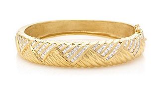 A 14 Karat Yellow Gold and Diamond Bangle Bracelet, 27.50 dwts.