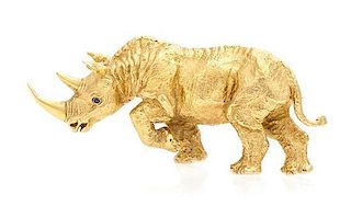 * An 18 Karat Yellow Gold and Sapphire Rhinoceros Brooch, Tiffany & Co., Germany, Circa 1991, 15.50 dwts.