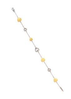 * An 18 Karat Yellow and White Gold Heart Motif Bracelet, Tiffany & Co., 5.80 dwts.