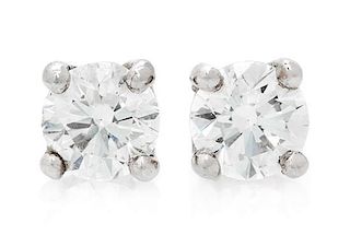 A Pair of Platinum and Diamond Stud Earrings, 0.80 dwts.
