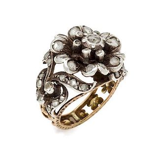 An Antique Silver, Yellow Gold and Diamond Floral Motif Ring, 6.30 dwts.