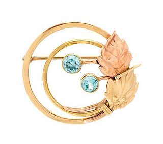 A Retro Rose Gold, Yellow Gold and Blue Zircon Circle Brooch, 4.90 dwts.