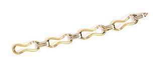 * An 18 Karat Yellow and White Gold Fancy Link Bracelet, 27.90 dwts.