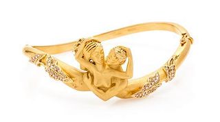 * An 18 Karat Yellow Gold and Diamond Passion Bangle Bracelet, Carrera y Carrera 27.60 dwts.