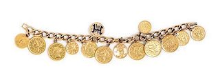 * A 14 Karat Yellow Gold Bracelet with 13 Attached Charms, 35.70 dwts.
