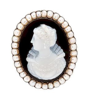 A Victorian Yellow Gold, Onyx Cameo and Seed Pearl Brooch, 8.00 dwts.