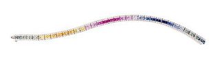 A 14 Karat White Gold, Multicolor Sapphire and Diamond Line Bracelet, 21.30 dwts.