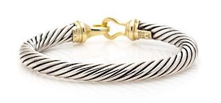 A Sterling Silver and 14 Karat Yellow Gold Cable Buckle Bracelet, David Yurman, 28.50 dwts.