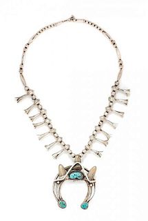 A Silver, Turquoise and Animal Teeth Squash Blossom Necklace, Glen Adakai, Navajo, 76.90 dwts.