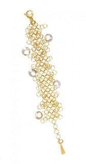 * An 18 Karat Yellow and White Gold Bracelet, Orlando Orlandini, 13.20 dwts.