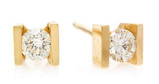 A Pair of Yellow Gold and Diamond Stud Earrings, 0.70 dwts.