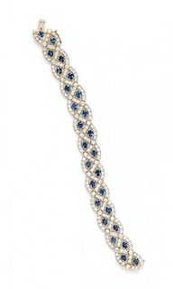 * A Bicolor Gold, Sapphire and Diamond Bracelet, 22.90 dwts.