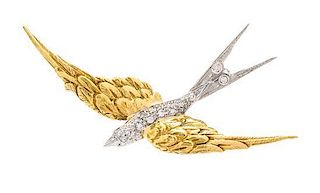 * An 18 Karat Bicolor Gold and Diamond Bird Motif Brooch, 3.80 dwts.