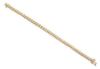 A 14 Karat Yellow Gold and Diamond Line Bracelet, 7.90 dwts.