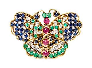 * A 14 Karat Yellow Gold, Emerald, Ruby, Sapphire and Diamond Butterfly Brooch, 10.10 dwts.