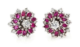 A Pair of White Gold, Diamond and Ruby Earclips, 6.90 dwts.