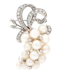 * A White Gold, Diamond and Cultured Pearl Pendant/Brooch, 10.00 dwts.