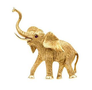 * A 14 Karat Yellow Gold and Ruby Elephant Brooch, 8.20 dwts.