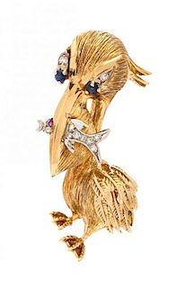 An 18 Karat Yellow Gold, Diamond, Sapphire and Ruby Pelican Brooch, 9.40 dwts.