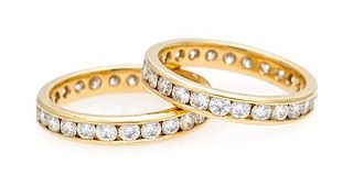 * A Pair of Yellow Gold and Diamond Eternity Bands, 3.00 dwts.