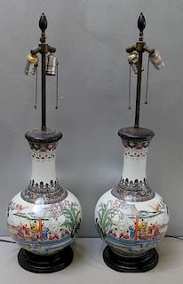 Pair of Asian Porcelain Lamps with Figural Motif.