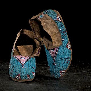 Sioux Beaded Buffalo Hide Moccasins with Painted Parfleche Soles 