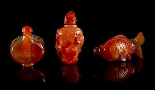 Three Carved Carnelian Agate Snuff Bottles Height of tallest 3 inches.