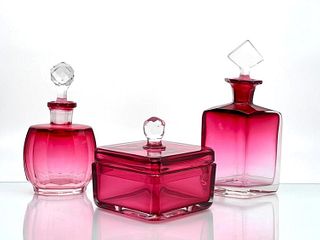 Three Cranberry Colored Glass Dresser Articles