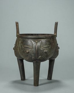 A taotie patterned double-eared copper pot