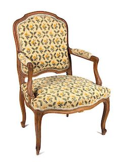 A Louis XV Style Walnut Fauteuil Height 37 1/4 inches.