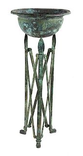 An Etruscan Style Patinated Metal Jardinière Height 41 1/2 inches.