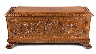 A Continental Carved Walnut Blanket Chest Height 21 1/2 x width 47 3/4 x depth 17 inches.