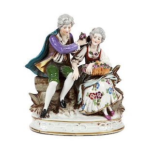 A German Sitzendorf Porcelain Figural Group Height 7 1/2 inches.