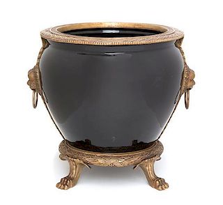 A Gilt Metal Mounted Ceramic Jardinière Height 13 1/2 inches.