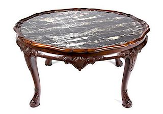An English Mahogany Low Coffee Table Height 19 x diameter 38 inches.