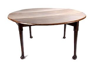 A Queen Anne Style Mahogany Drop-Leaf Table Height 29 x width 57 (leaves up) x depth 56 inches.