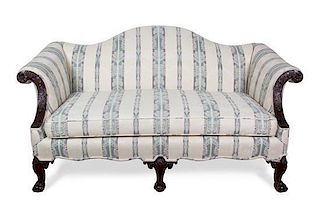 A Chippendale Style Mahogany Camel Back Love Seat Height 34 x width 64 x depth 36 inches.