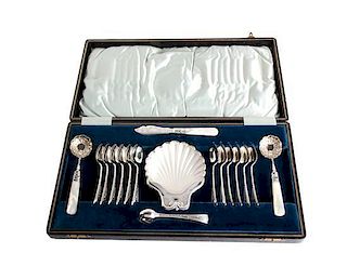 An English Silver Plate and Mother-of-Pearl Handled Dessert Set Length of largest spoon 6 inches.