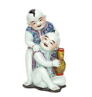 A Chinese Polychromed Ceramic Figural Group Height 15 inches.