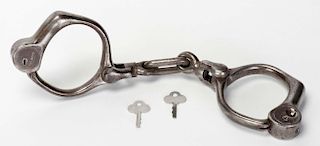 Bean Cobb Handcuffs. Circa 1899. Popular handcuff which, when patented, offered a significant improv