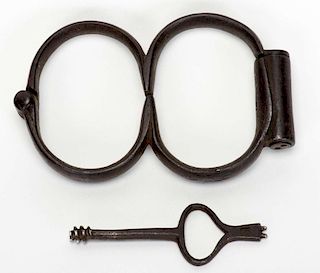 Plug 8 Handcuffs. Circa 1850. Cuffs that resemble the number с8о in shape. A plug blocks the keyhole