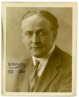 Houdini, Harry. Sepia Tone Vintage Portrait of Houdini. Circa 1924. Formal studio photo of Harry Hou