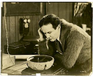 Houdini, Harry. Movie Still of Houdini in Terror Island. Los Angeles, [1920]. Sepia tone proof photo