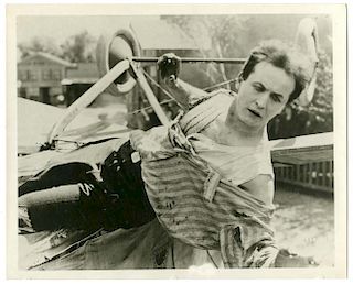 Houdini, Harry. Movie Still of Houdini Hanging from Airplane in The Grim Game. Los Angeles: Paramoun