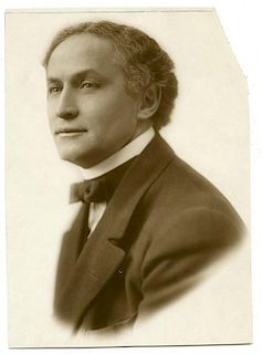 Houdini, Harry. Bust Photo of Houdini, signed by Marie Hinson. Ca. 1920. Studio portrait of Houdini