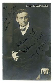 Houdini, Harry. Inscribed and Signed Real Photo Postcard. Circa 1910. Striking silver print half-len