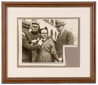 Houdini, Harry. Challenge Photo. Strait Jacket Escape. N.p., ca. 1920. Vintage silver print showing